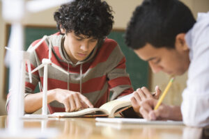 Teenage students studying wind power